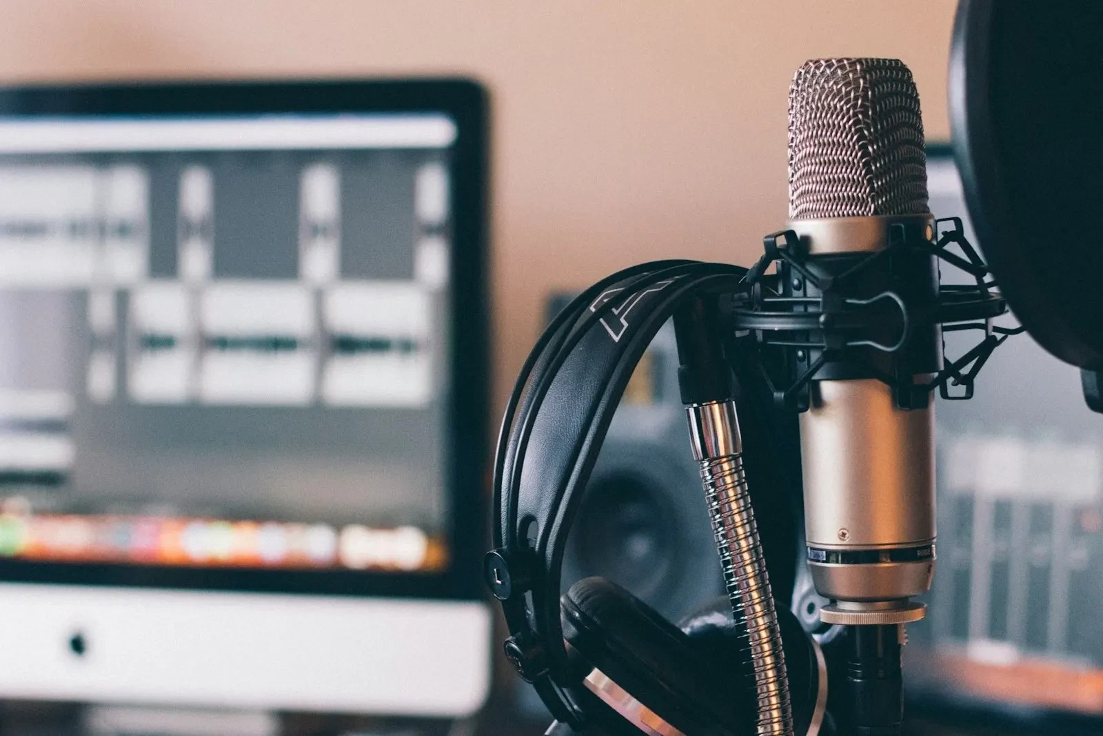 Close-up of a real studio microphone and headphones in a recording environment